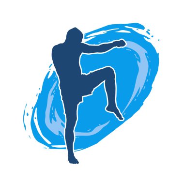 Hareketli erkek kickboksör atletinin silueti. Tekme atan bir adamın silueti..