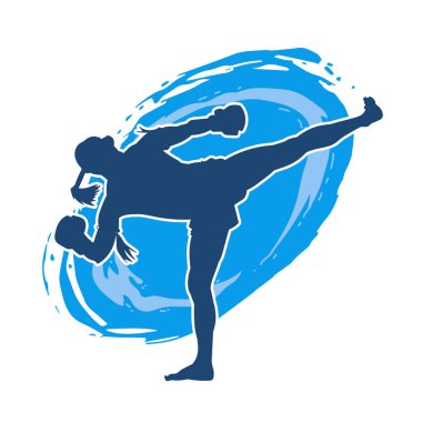 Hareketli erkek kickboksör atletinin silueti. Tekme atan bir adamın silueti..