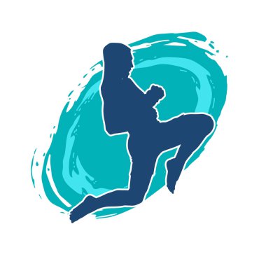 Hareketli erkek kickboksör atletinin silueti. Tekme atan bir adamın silueti..