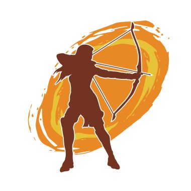 Dişi okçu bir dövüşçünün silueti ok ve yayla pozisyonunu alıyor..