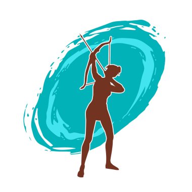 Dişi okçu bir dövüşçünün silueti ok ve yayla pozisyonunu alıyor..