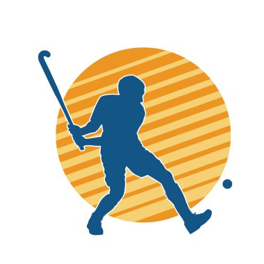 Erkek çim hokeyi atletinin silueti iş başında. Çim hokeyi oynayan bir adamın silueti..