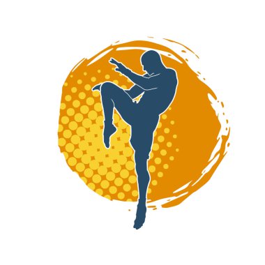 Hareketli erkek kickboksör atletinin silueti. Tekme atan bir adamın silueti..
