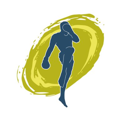 Hareketli erkek kickboksör atletinin silueti. Tekme atan bir adamın silueti..