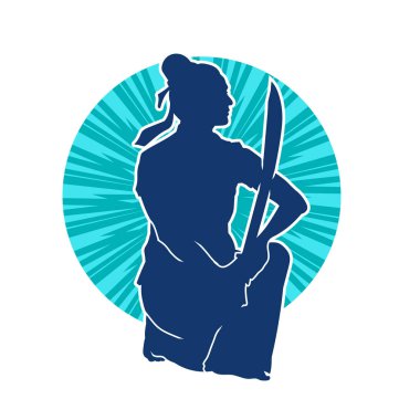 Bir kadın savaşçının silueti kılıç ile hareket halindeyken poz veriyor. Kılıcıyla bir kadın kahramanın silüeti..