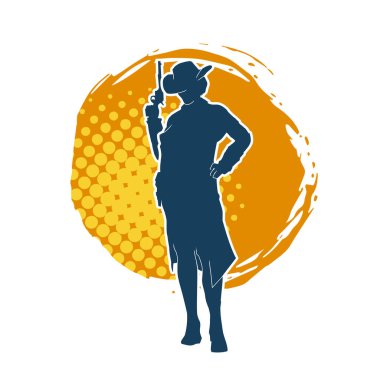 Hareket halindeki bir kovboyun silueti silah taşıyan bir poz veriyor. Kovboy kostümü giymiş siluet tabanca taşıyan bir erkek..