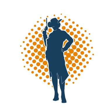 Hareket halindeki bir kovboyun silueti silah taşıyan bir poz veriyor. Kovboy kostümü giymiş siluet tabanca taşıyan bir erkek..