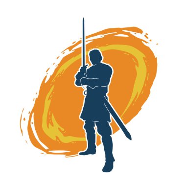 Bir erkek savaşçının silueti kılıçla poz veriyor. Kılıç taşıyan bir savaşçının silueti..