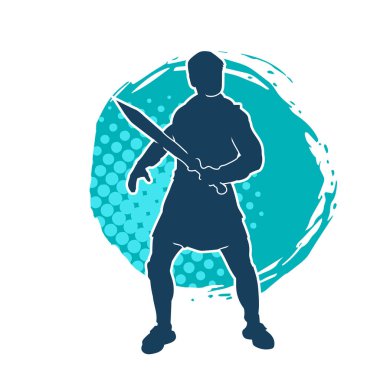 Bir erkek savaşçının silueti kılıçla poz veriyor. Kılıç taşıyan bir savaşçının silueti..