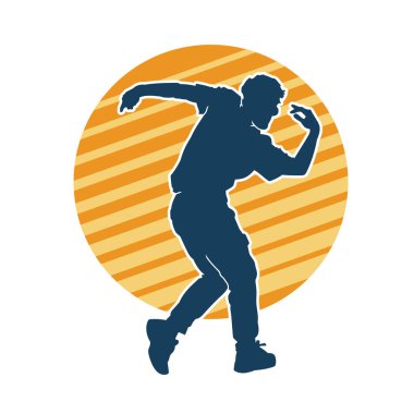 Hareket halindeki bir erkek dansçının silueti. Dans eden zayıf bir adamın silueti..