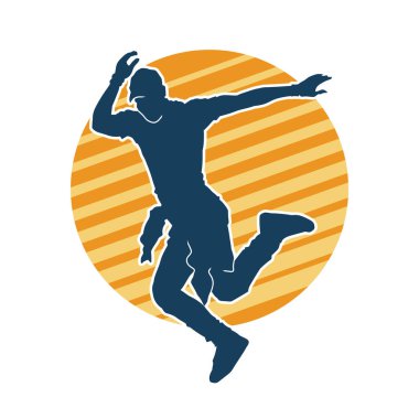 Hareket halindeki bir erkek dansçının silueti. Dans eden zayıf bir adamın silueti..