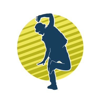 Hareket halindeki bir erkek dansçının silueti. Dans eden zayıf bir adamın silueti..