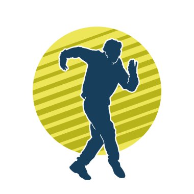 Hareket halindeki bir erkek dansçının silueti. Dans eden zayıf bir adamın silueti..