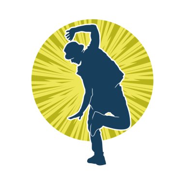 Hareket halindeki bir erkek dansçının silueti. Dans eden zayıf bir adamın silueti..