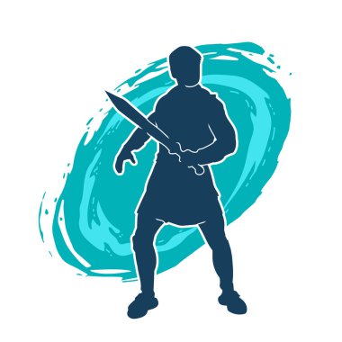 Bir erkek savaşçının silueti kılıçla poz veriyor. Kılıç taşıyan bir savaşçının silueti..