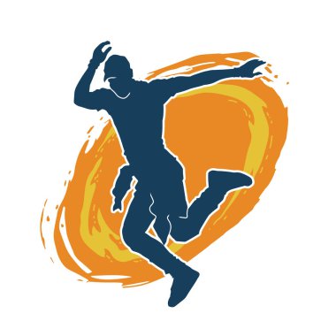 Hareket halindeki bir erkek dansçının silueti. Dans eden zayıf bir adamın silueti..