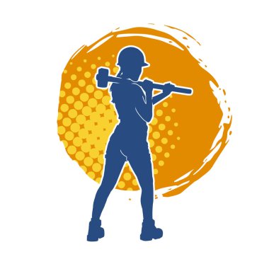 Açık havada çalışan bir modelin silueti balyoz teçhizatıyla poz veriyor.