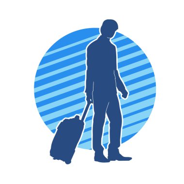 Seyahat valizi taşıyan bir erkek yolcunun silueti.