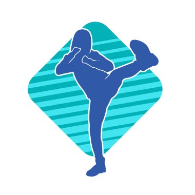 Dövüş sanatları tekmesi atan bir kadının silueti. Sportif bir kadının silueti tekme hareketi yapıyor..