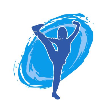 Dövüş sanatları tekmesi atan bir kadının silueti. Sportif bir kadının silueti tekme hareketi yapıyor..