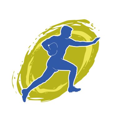 Rugby sporcusunun silueti iş başında. Rugby oynayan sporcu bir adamın silueti..
