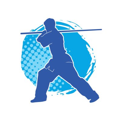 Dövüş sanatlarında dövüşen bir erkeğin silüeti, tahta sopayı silah olarak kullanıyor. Tahta sırıkla dövüş sanatları yapan bir adamın silueti..