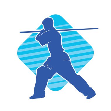 Dövüş sanatlarında dövüşen bir erkeğin silüeti, tahta sopayı silah olarak kullanıyor. Tahta sırıkla dövüş sanatları yapan bir adamın silueti..