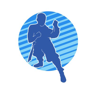 Doğu dövüş sanatı pozu veren bir adamın silueti. Dövüş sanatlarında bir erkeğin silueti..