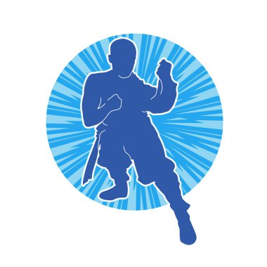 Doğu dövüş sanatı pozu veren bir adamın silueti. Dövüş sanatlarında bir erkeğin silueti..