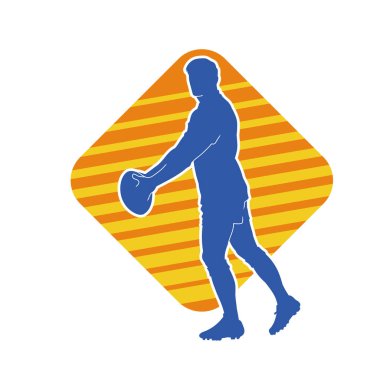 Rugby sporcusunun silueti iş başında. Rugby oynayan sporcu bir adamın silueti..