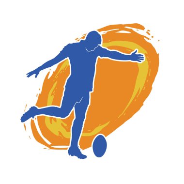 Rugby sporcusunun silueti iş başında. Rugby oynayan sporcu bir adamın silueti..