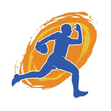 Rugby sporcusunun silueti iş başında. Rugby oynayan sporcu bir adamın silueti..