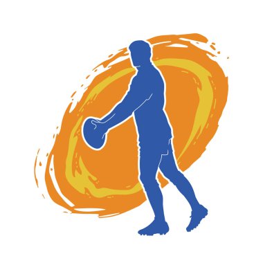 Rugby sporcusunun silueti iş başında. Rugby oynayan sporcu bir adamın silueti..