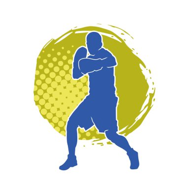 Erkek boks atletinin silueti iş başında. Boks sporu için eldiven giyen kaslı bir adamın silueti..