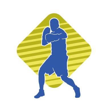 Erkek boks atletinin silueti iş başında. Boks sporu için eldiven giyen kaslı bir adamın silueti..