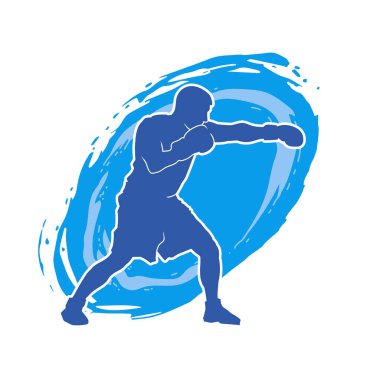 Erkek boks atletinin silueti iş başında. Boks sporu için eldiven giyen kaslı bir adamın silueti..