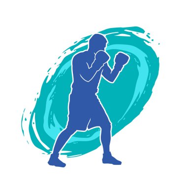 Erkek boks atletinin silueti iş başında. Boks sporu için eldiven giyen kaslı bir adamın silueti..