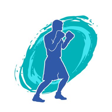 Erkek boks atletinin silueti iş başında. Boks sporu için eldiven giyen kaslı bir adamın silueti..