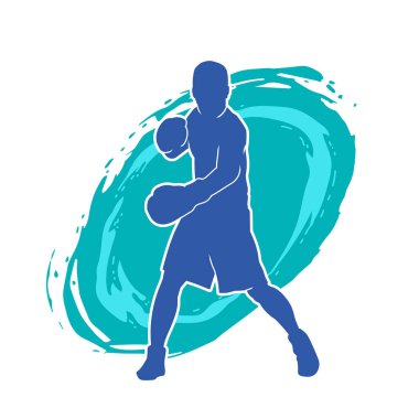 Erkek boks atletinin silueti iş başında. Boks sporu için eldiven giyen kaslı bir adamın silueti..