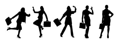 Silüet bir grup iş kadını, evrak çantası taşıyorlar.