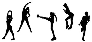 Siluet grubu spor yapan bir grup kadın aerobik egzersizler yapıyor.