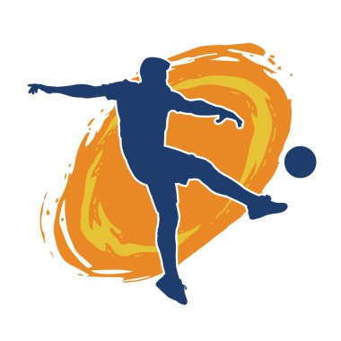 Top tekmeleyen bir erkek futbolcunun silueti. Hareket halindeki bir futbolcunun silueti.