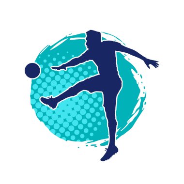 Top tekmeleyen bir erkek futbolcunun silueti. Hareket halindeki bir futbolcunun silueti.