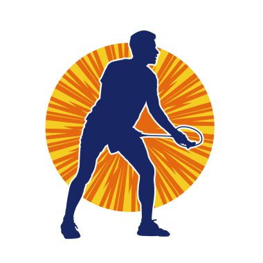 Badminton sporu yapan zayıf bir erkek atletin silueti. Badminton oynayan bir adamın silueti..