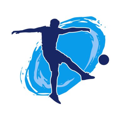 Top tekmeleyen bir erkek futbolcunun silueti. Hareket halindeki bir futbolcunun silueti.