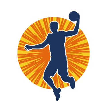 Hareketli bir erkek basketbolcunun silueti. Basketbol oynayan bir adamın silüeti..