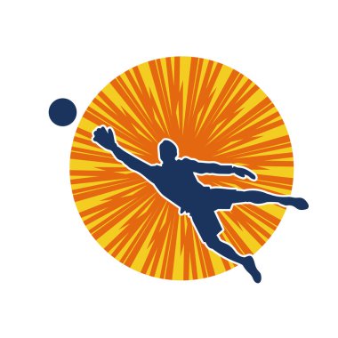 Erkek bir futbol kalecisinin silueti zıplayarak topa yaklaşıyor.
