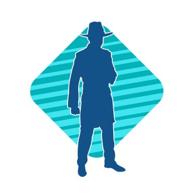 Uzun paltolu ve kovboy şapkalı bir adamın silueti.