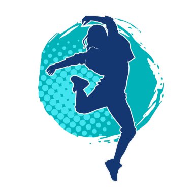 Modern dansçı pozunun silueti. Hip hop dansı yapan genç bir kızın silueti.