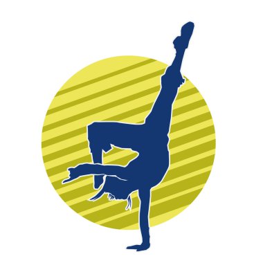 Modern dansçı pozunun silueti. Hip hop dansı yapan genç bir kızın silueti.